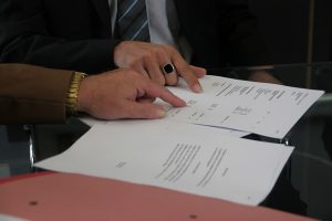 Image shows to people going over a lease.