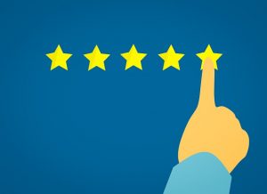 Image is a hand selecting a five star rating.
