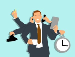 Image is an illustration of a man multitasking. Image is an illustration of a man multitasking.